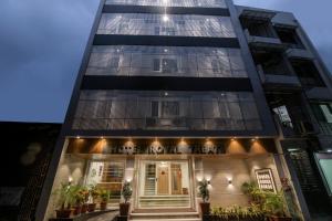 a building with a sign that reads love cafe at Hotel Royal Treat Surat in Surat