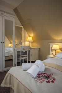 Posteľ alebo postele v izbe v ubytovaní Carlina Hotel & SPA