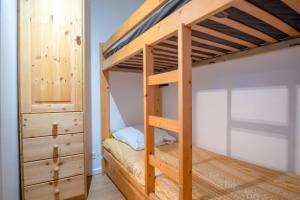 Rúm í herbergi á Appartement Fontana - Welkeys