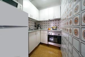 Kuchyňa alebo kuchynka v ubytovaní Apartamentos Río Piedras