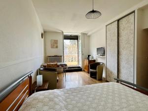 Posteľ alebo postele v izbe v ubytovaní Résidence l'Hermitage - appart face aux thermes