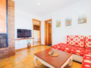 a living room with a couch and a coffee table at Cubo's Villa La Gitanilla in Mijas