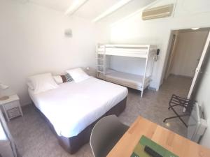 Postel nebo postele na pokoji v ubytování L'auberge Camarguaise
