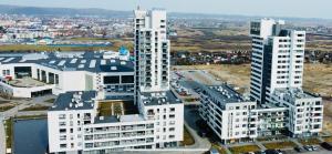 an aerial view of a city with tall buildings at Apartament 44 Aquapark Reda in Reda