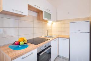 Kuchyň nebo kuchyňský kout v ubytování Apartments Sucic