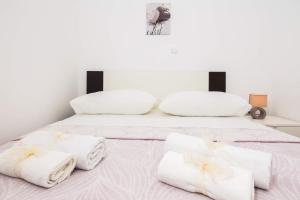 Postel nebo postele na pokoji v ubytování Apartments Sucic