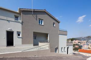 a building with a view of a city at Apartments Sucic in Sevid