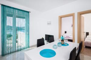 Postel nebo postele na pokoji v ubytování Apartments Sucic
