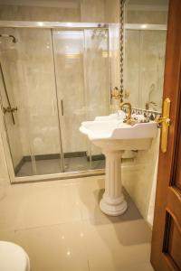 a bathroom with a sink and a shower at Hotel Bajamar Centro in Nerja