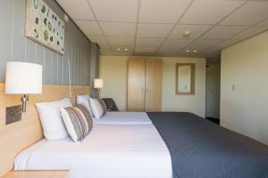 Postel nebo postele na pokoji v ubytování Hotel De Boei