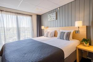 Postel nebo postele na pokoji v ubytování Hotel De Boei