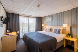 Postel nebo postele na pokoji v ubytování Hotel De Boei