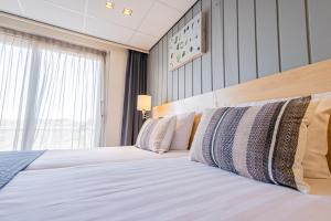 Postel nebo postele na pokoji v ubytování Hotel De Boei