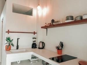 a kitchen with a sink and a counter top at Ayampe Lofts in Ayampe