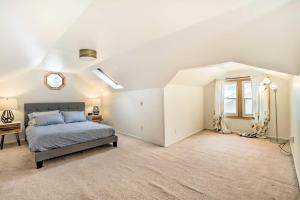 a bedroom with a bed and a window at Minneapolis Vacation Rental Near Lake Harriet in Minneapolis