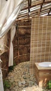 a tent with a toilet and a stone floor at Imani Eco Sky Lodge Ngoc Chien in Nam San