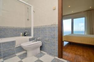 a bathroom with a toilet and a tub and a sink at Villa en Platja de Aro with pool 450m from the beach in Platja  d'Aro +60 photos