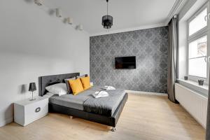 Posteľ alebo postele v izbe v ubytovaní Apartamenty Haffnera by Grand Apartments