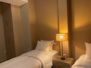 A bed or beds in a room at Athens Gem