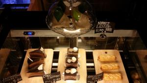 a glass display case with different types of pastries at Go Hotel in Subang Jaya