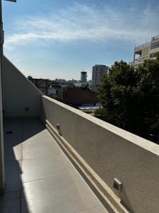 a ledge of a building with a view of a city at Purobaires Hotel Boutique in Buenos Aires