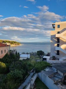 a view of the ocean from a building at Charming apartment, 2 garage parking in Split