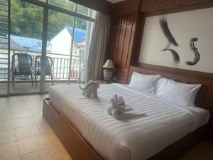Katil atau katil-katil dalam bilik di Talya Patong Hotel