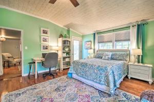 a bedroom with a bed and a desk and a chair at Lakeside Kent Home with Pier and Boat Ramp Access in Waterport