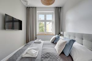 Posteľ alebo postele v izbe v ubytovaní Apartamenty Haffnera by Grand Apartments