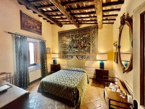 Postel nebo postele na pokoji v ubytování VesConte Residenza D'epoca dal 1533