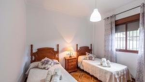 Łóżko lub łóżka w pokoju w obiekcie Fuente Barrera El Gastor by Ruralidays
