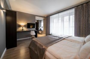 Tempat tidur dalam kamar di Hotel Rango