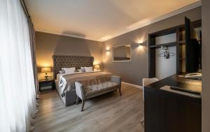Tempat tidur dalam kamar di Hotel Rango