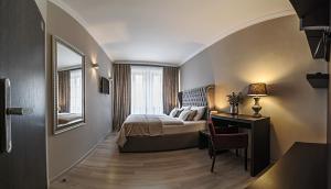 Tempat tidur dalam kamar di Hotel Rango