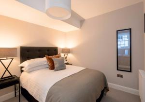 a bedroom with a large bed and a window at Luxury apartment, Stafford Street in Edinburgh