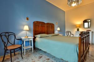 A bed or beds in a room at GuestHost - Casa Vita Roomy Apartment