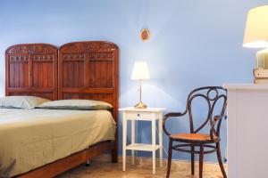 A bed or beds in a room at GuestHost - Casa Vita Roomy Apartment