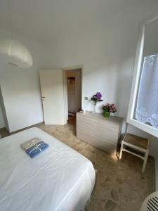 A bed or beds in a room at La Casina di Forte