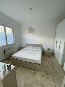 A bed or beds in a room at La Casina di Forte
