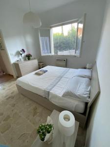A bed or beds in a room at La Casina di Forte