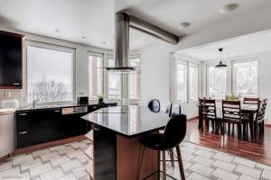 a kitchen with a island in the middle of a room at Grand Villa Kivistö near Helsinki airport in Vantaa