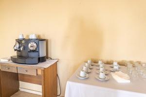 Coffee and tea making facilities at Aeropuerto Sur Hotel
