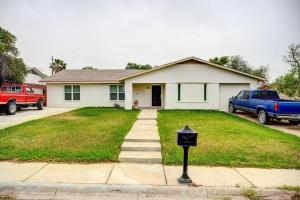 a parking meter in front of a house at Centrally Located Eagle Pass Home with Pool! in Eagle Pass