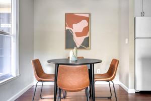 a dining room with a black table and chairs at Sunnyvale 1BR w Gym WD Lounge nr Google SFO-839 in Sunnyvale