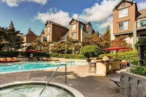 a swimming pool with a hot tub and some buildings at Sunnyvale 1BR w Gym WD Lounge nr Google SFO-839 in Sunnyvale
