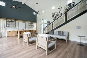 a living room with chairs and a staircase at Sunnyvale 1BR w WD Pool Gym near Googleplex SFO-1112 in Sunnyvale