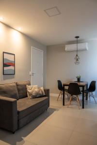 a living room with a couch and a table at Art Inn Porto in Rio de Janeiro