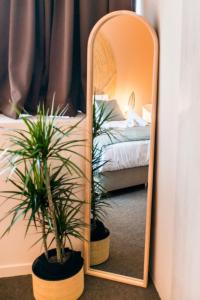 A bed or beds in a room at Athens Gem
