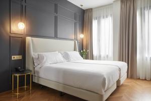 Postel nebo postele na pokoji v ubytování HOTEL ARRiZUL CATEDRAL 3 SUP