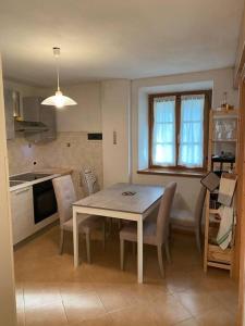 a kitchen and dining room with a table and chairs at Casa Luciana nel cuore dell'Alpe(022102-AT-849663) in Bertoldi